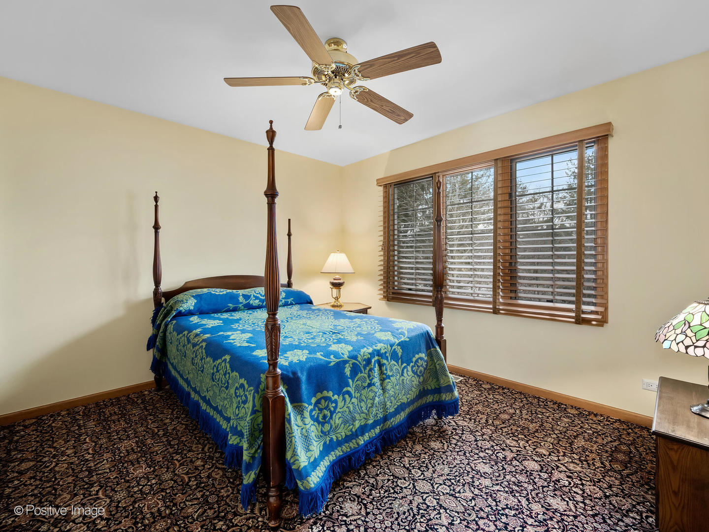 15-w601 81st Street Burr Ridge, IL 60527 - Photo 25 of 42 a bedroom with a bed a window and a chandelier