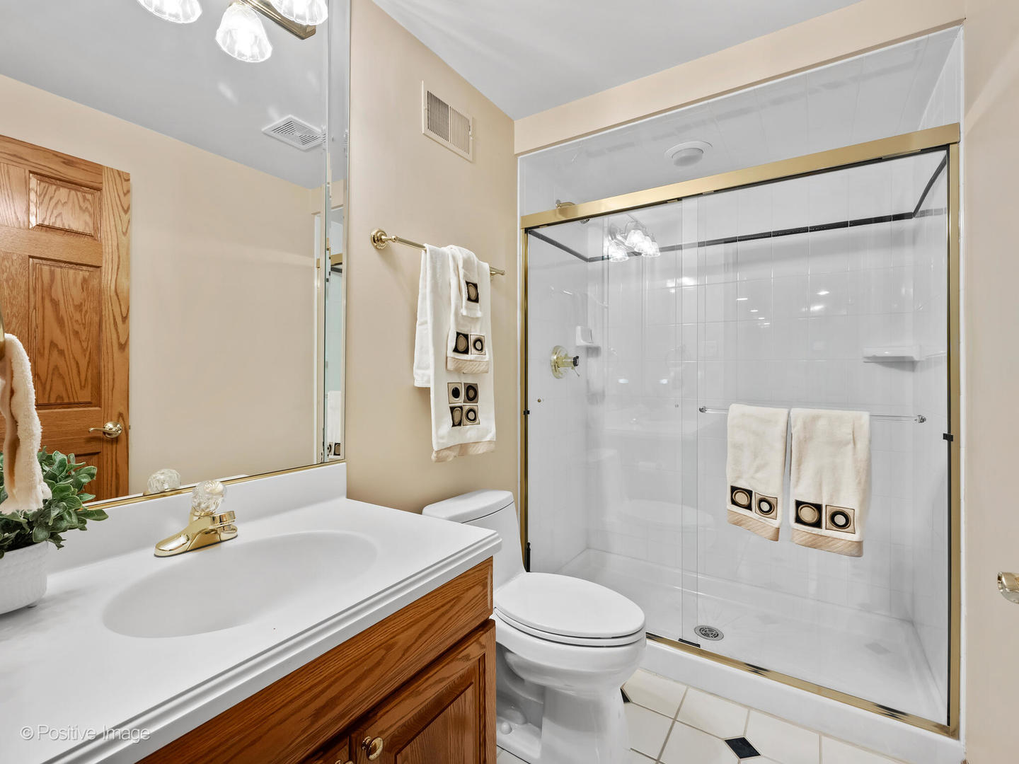 15-w601 81st Street Burr Ridge, IL 60527 - Photo 29 of 42 a bathroom with a sink toilet vanity and shower