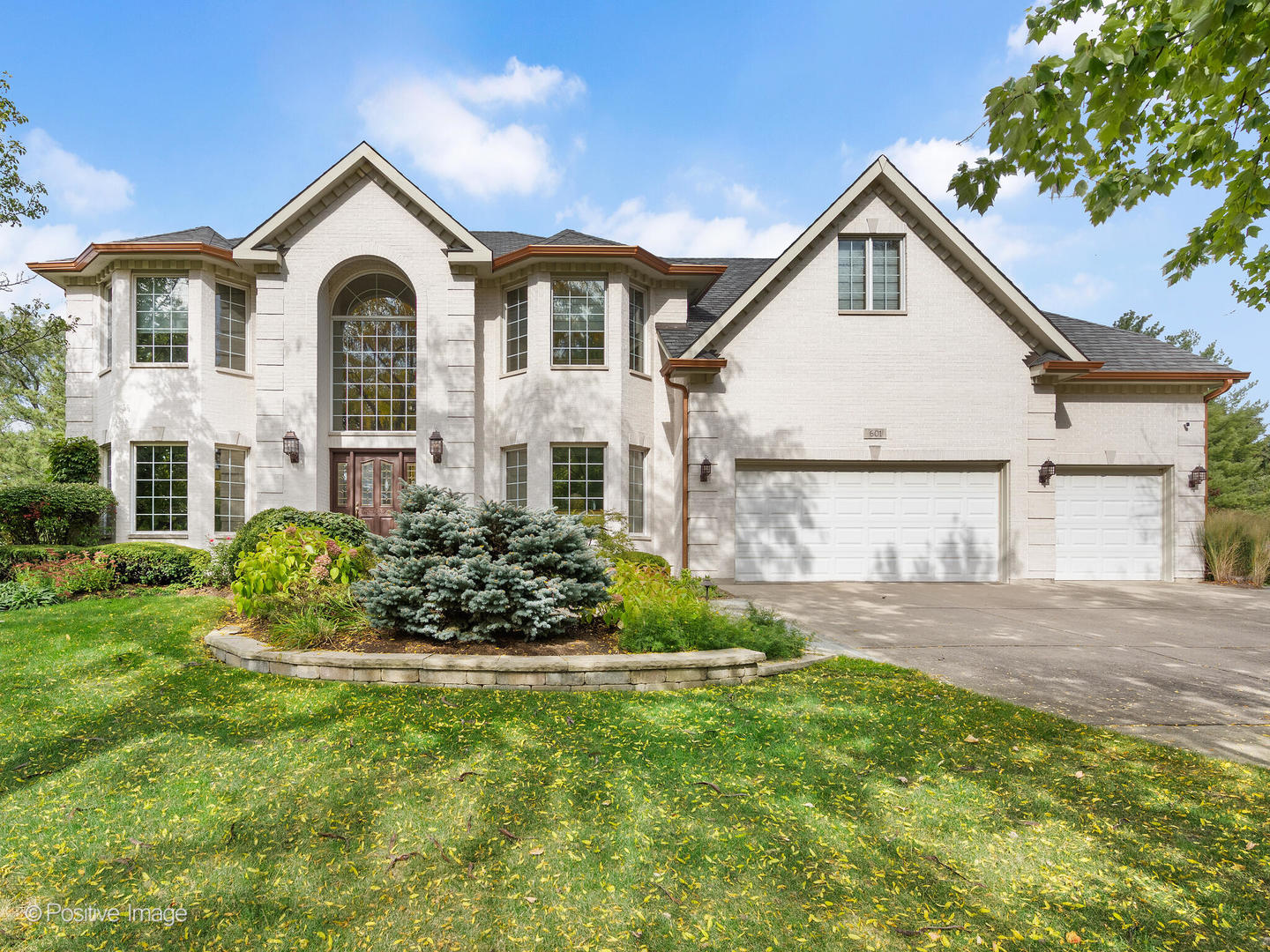 15-w601 81st Street Burr Ridge, IL 60527 - Photo 3 of 42 a front view of a house with a garden