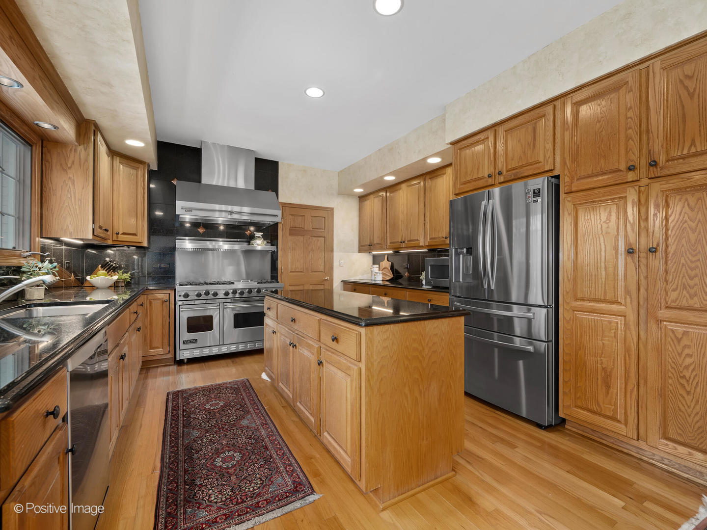15-w601 81st Street Burr Ridge, IL 60527 - Photo 9 of 42 a kitchen with stainless steel appliances granite countertop a refrigerator stove and sink