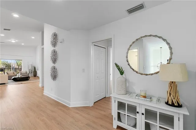 a kitchen with cabinets appliances a sink and a window
