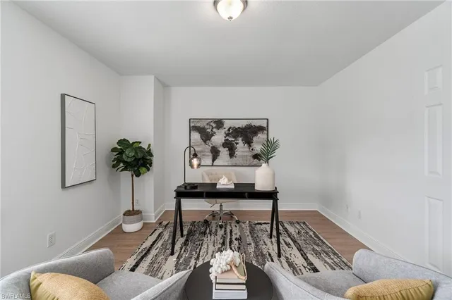 a bathroom with a granite countertop sink a large mirror and a bathtub