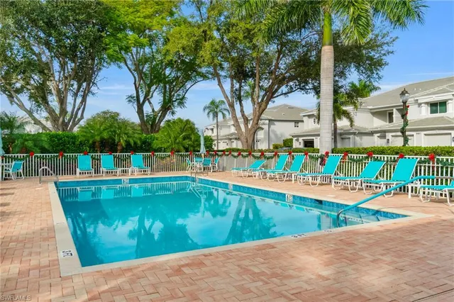 a view of a swimming pool with a patio