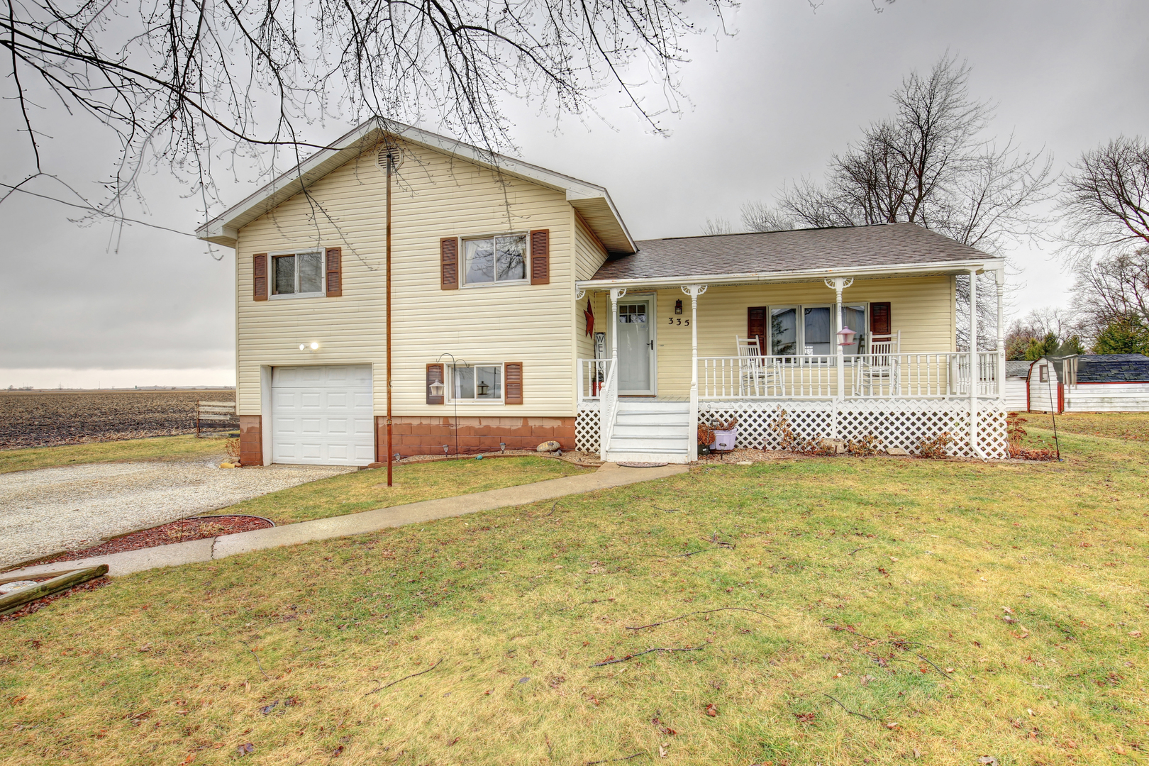 335 Dodge Street Cisco, IL 61830 - Photo 1 of 16 a front view of a house with a yard