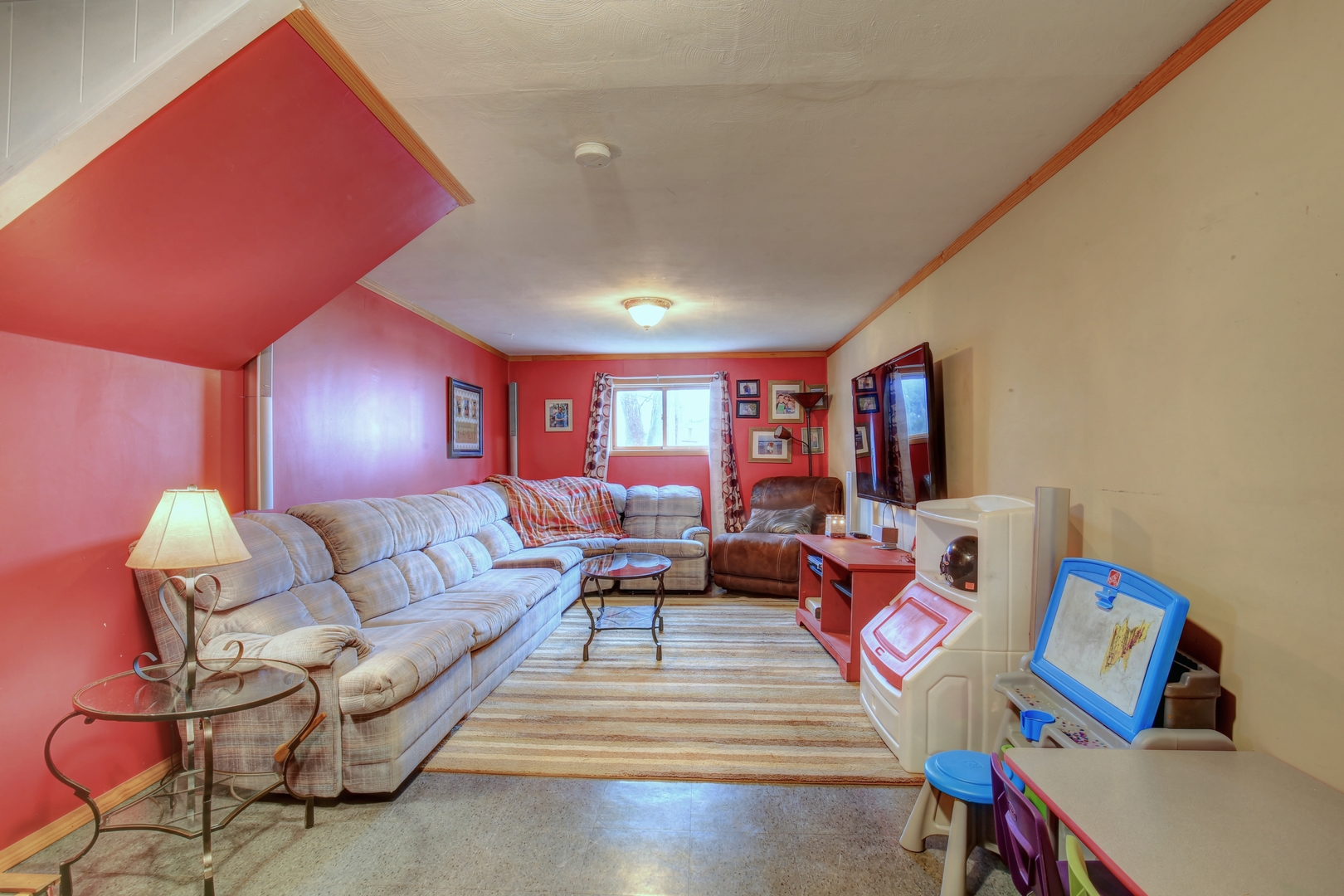 335 Dodge Street Cisco, IL 61830 - Photo 13 of 16 a living room with furniture and a flat screen tv