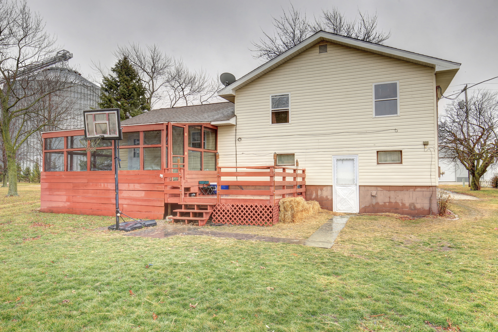 335 Dodge Street Cisco, IL 61830 - Photo 15 of 16 a view of a house with backyard porch and sitting area