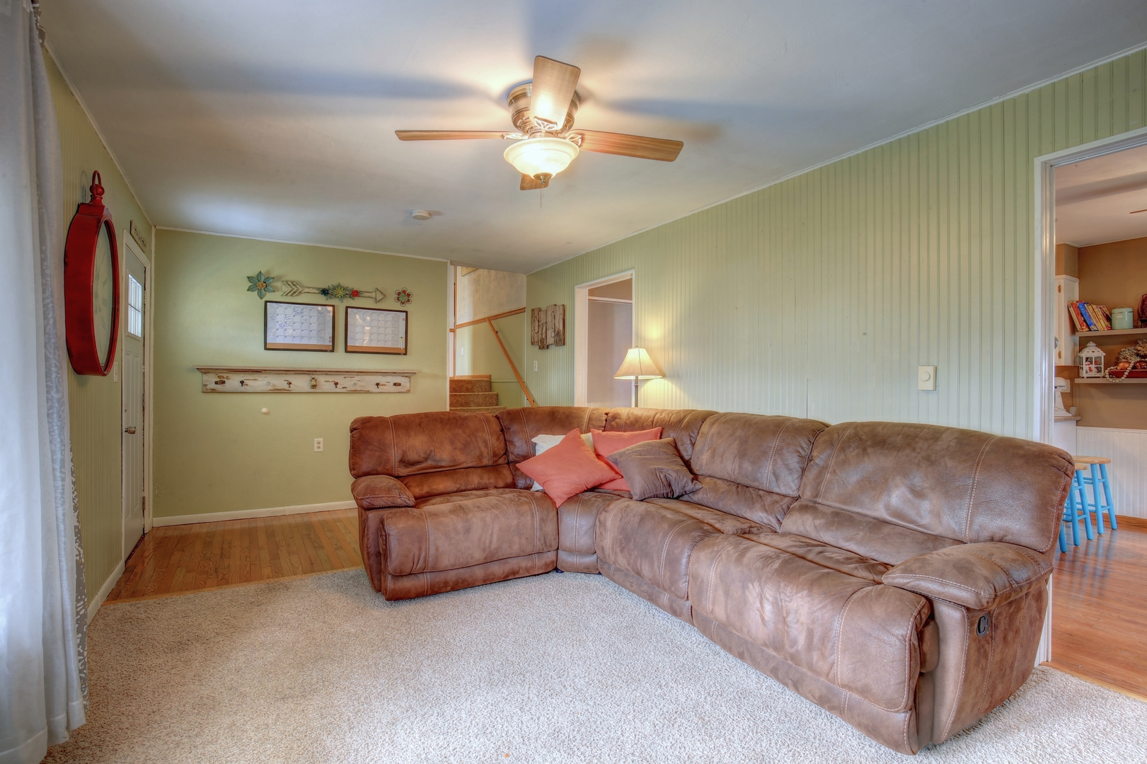 335 Dodge Street Cisco, IL 61830 - Photo 3 of 16 a living room with furniture and a chandelier