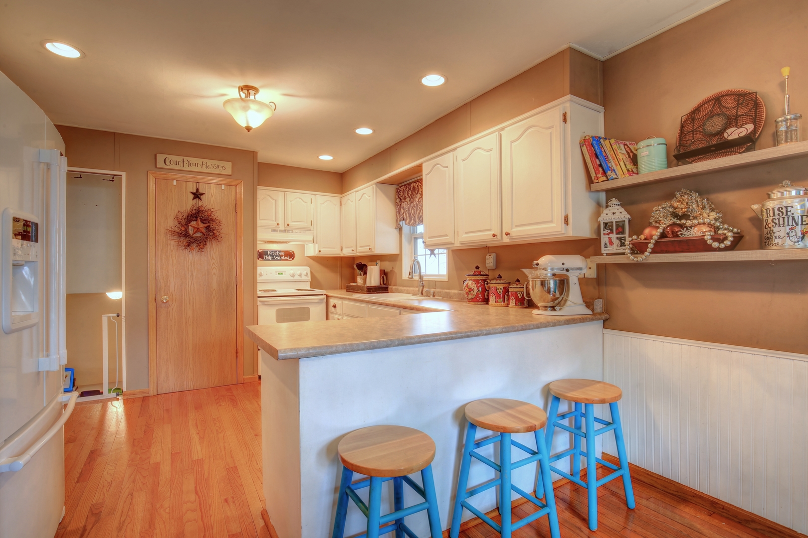 335 Dodge Street Cisco, IL 61830 - Photo 4 of 16 a kitchen with stainless steel appliances granite countertop a sink and a refrigerator