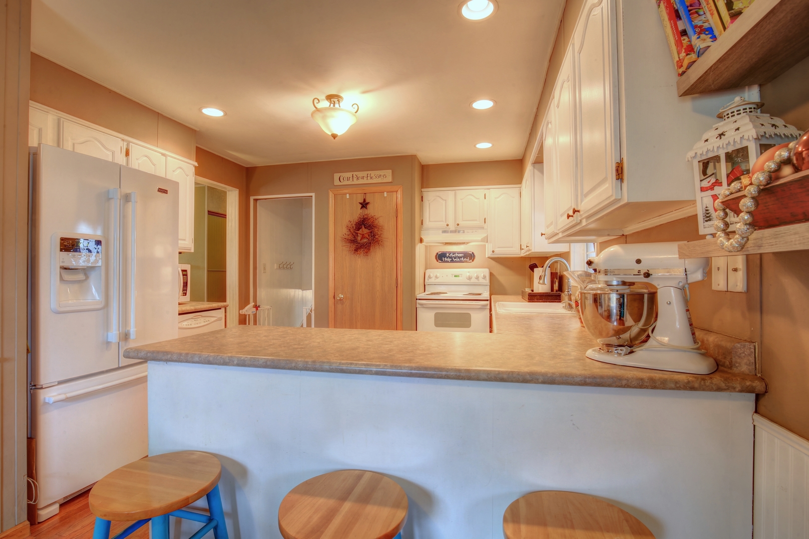 335 Dodge Street Cisco, IL 61830 - Photo 5 of 16 a kitchen with stainless steel appliances granite countertop a sink and a refrigerator