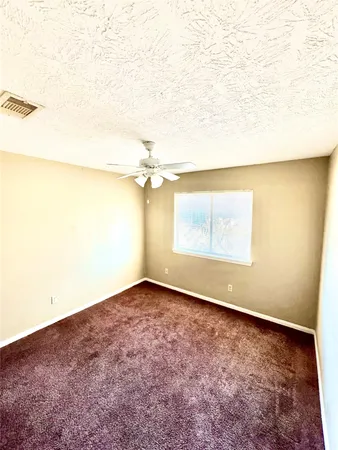 an empty room with a empty space and a window