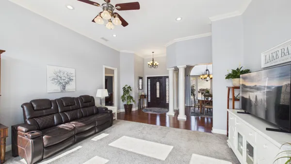 a kitchen with stainless steel appliances granite countertop a sink a stove and a refrigerator