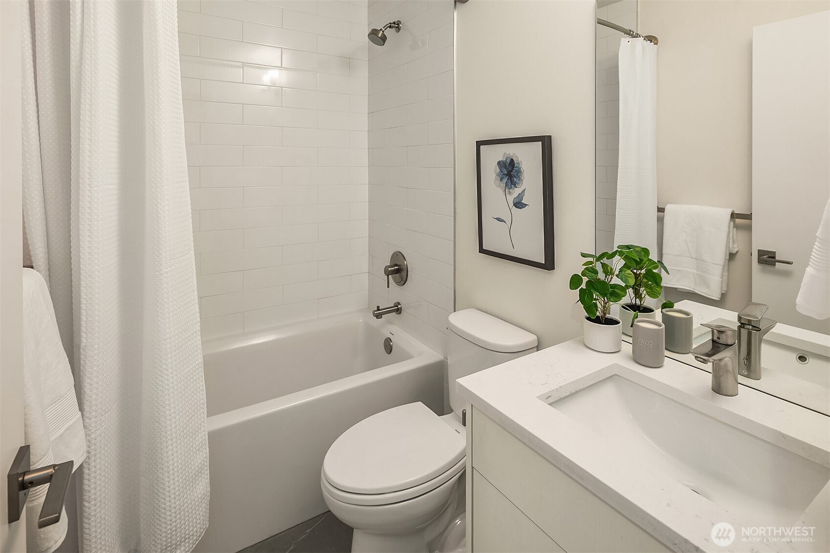 4308 26th Avenue Southwest, Unit F Seattle, WA 98106 - Photo 12 of 21 a bathroom with a sink a toilet and shower