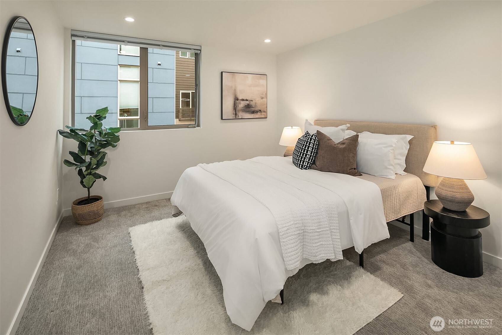 4308 26th Avenue Southwest, Unit F Seattle, WA 98106 - Photo 13 of 21 a bedroom with bed and a potted plant