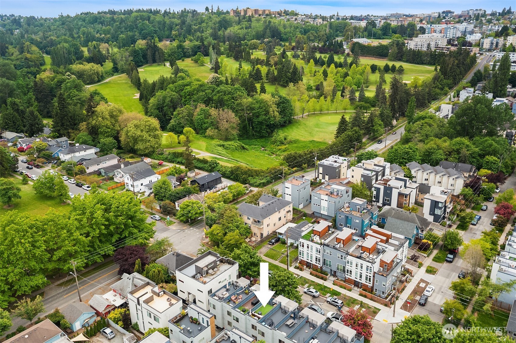 4308 26th Avenue Southwest, Unit F Seattle, WA 98106 - Photo 17 of 21 an aerial view of residential houses with outdoor space and trees
