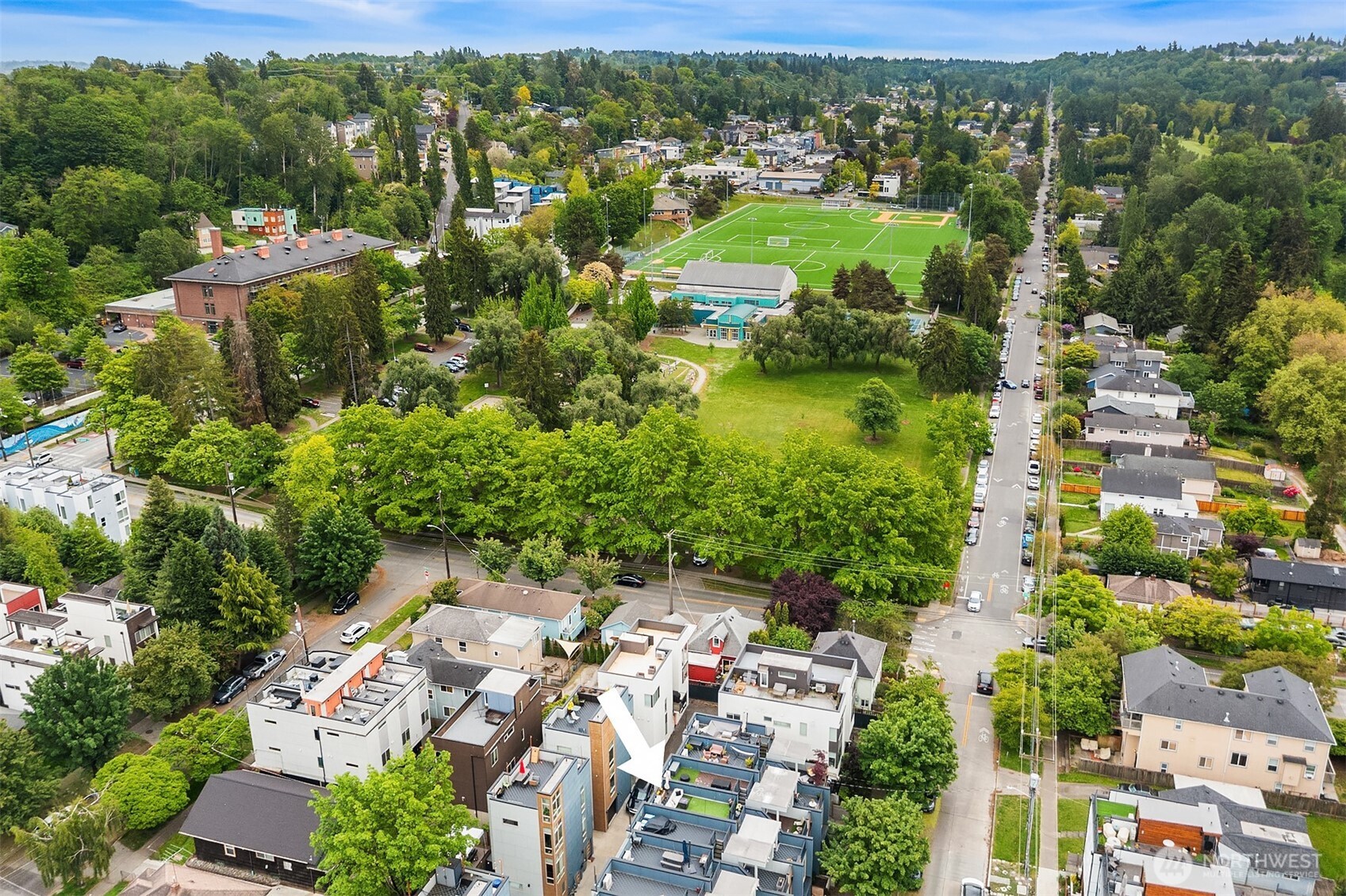 4308 26th Avenue Southwest, Unit F Seattle, WA 98106 - Photo 19 of 21 an aerial view of residential houses with outdoor space and trees