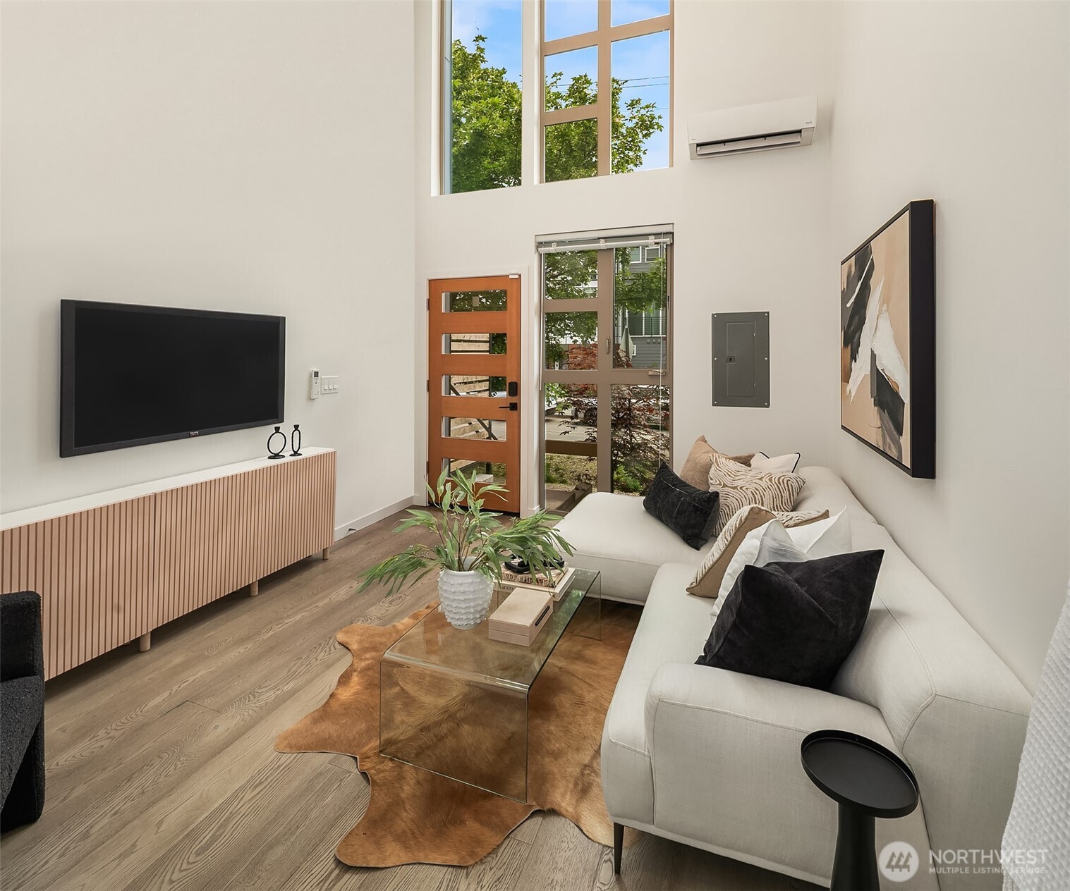 4308 26th Avenue Southwest, Unit F Seattle, WA 98106 - Photo 4 of 21 a living room with furniture and a flat screen tv