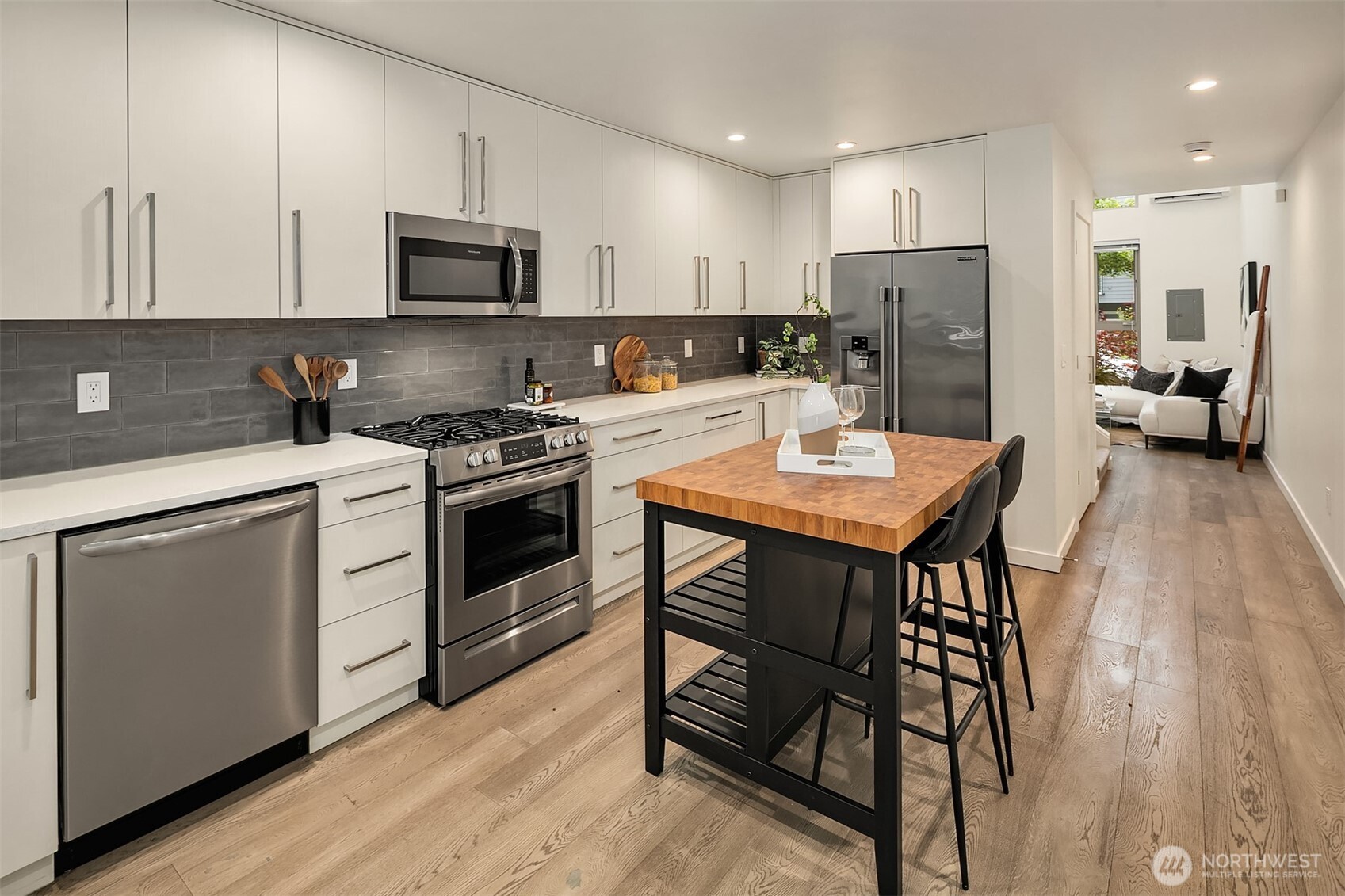 4308 26th Avenue Southwest, Unit F Seattle, WA 98106 - Photo 8 of 21 a kitchen with a refrigerator a stove a sink and a refrigerator