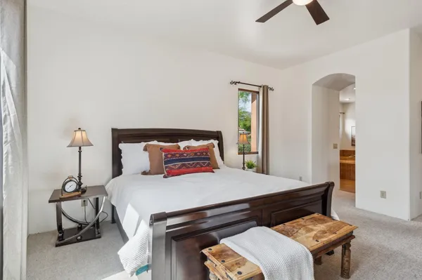 a bedroom with a bed and a couch