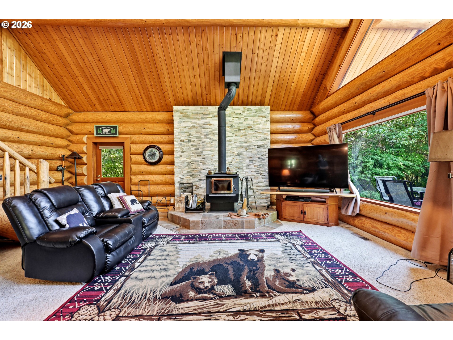 390 Spruce Creek Road Longview, WA 98632 - Photo 16 of 45 a living room with furniture fireplace and flat screen tv