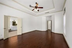 a view of an empty room and wooden floor