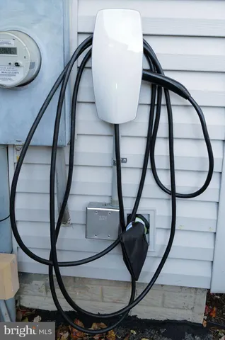a view of staircase with a potted plant and wooden floor