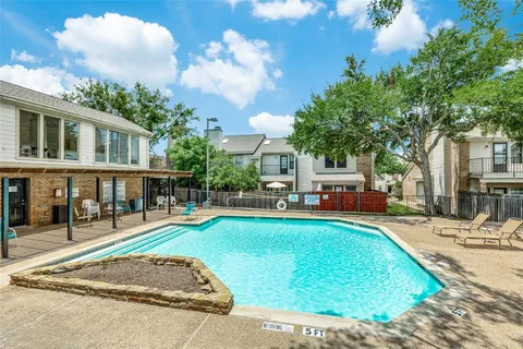 a view of a house with swimming pool and sitting area