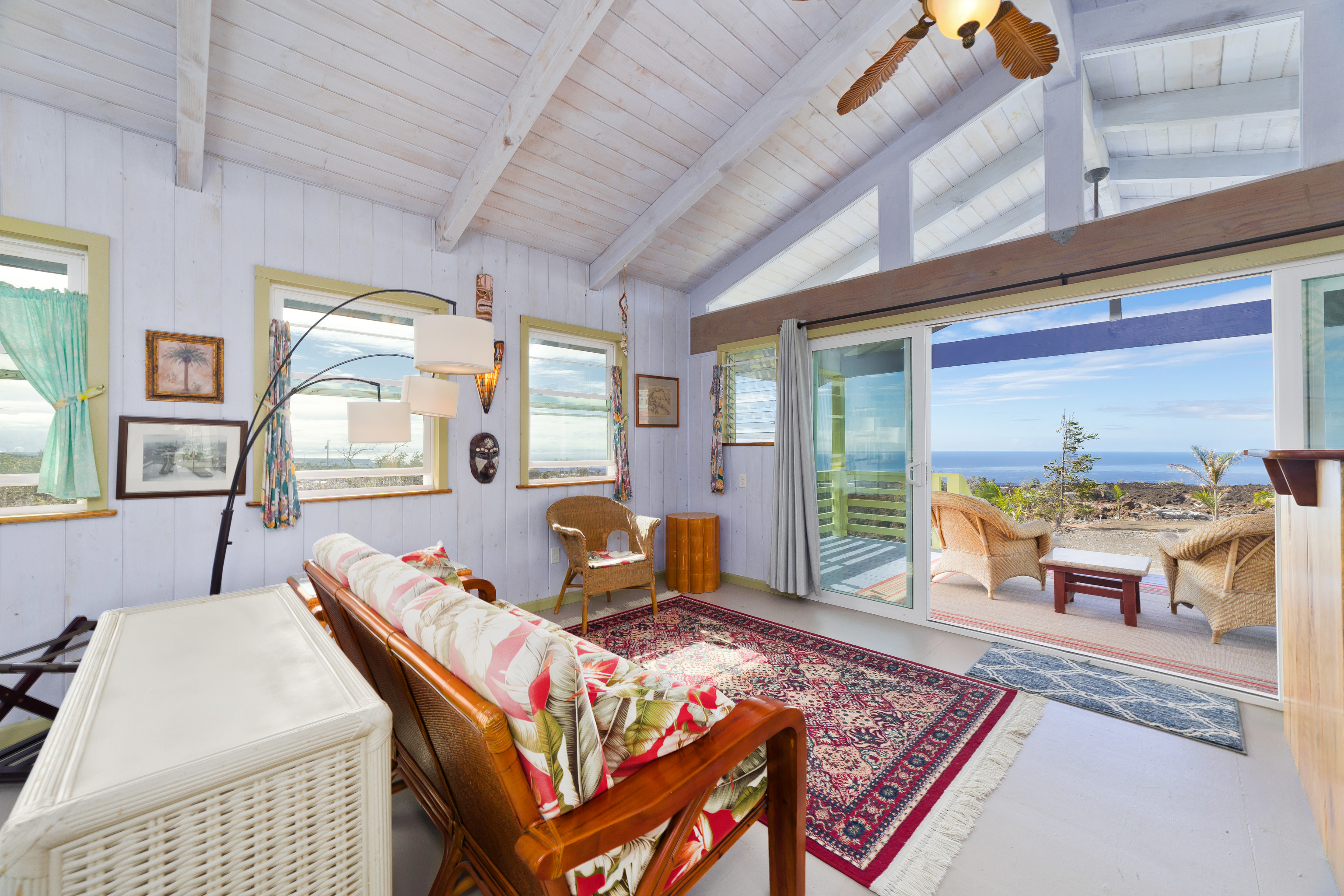 92-8427 Hibiscus Drive Ocean View, HI 96704 - Photo 21 of 30 a living room with furniture and a table