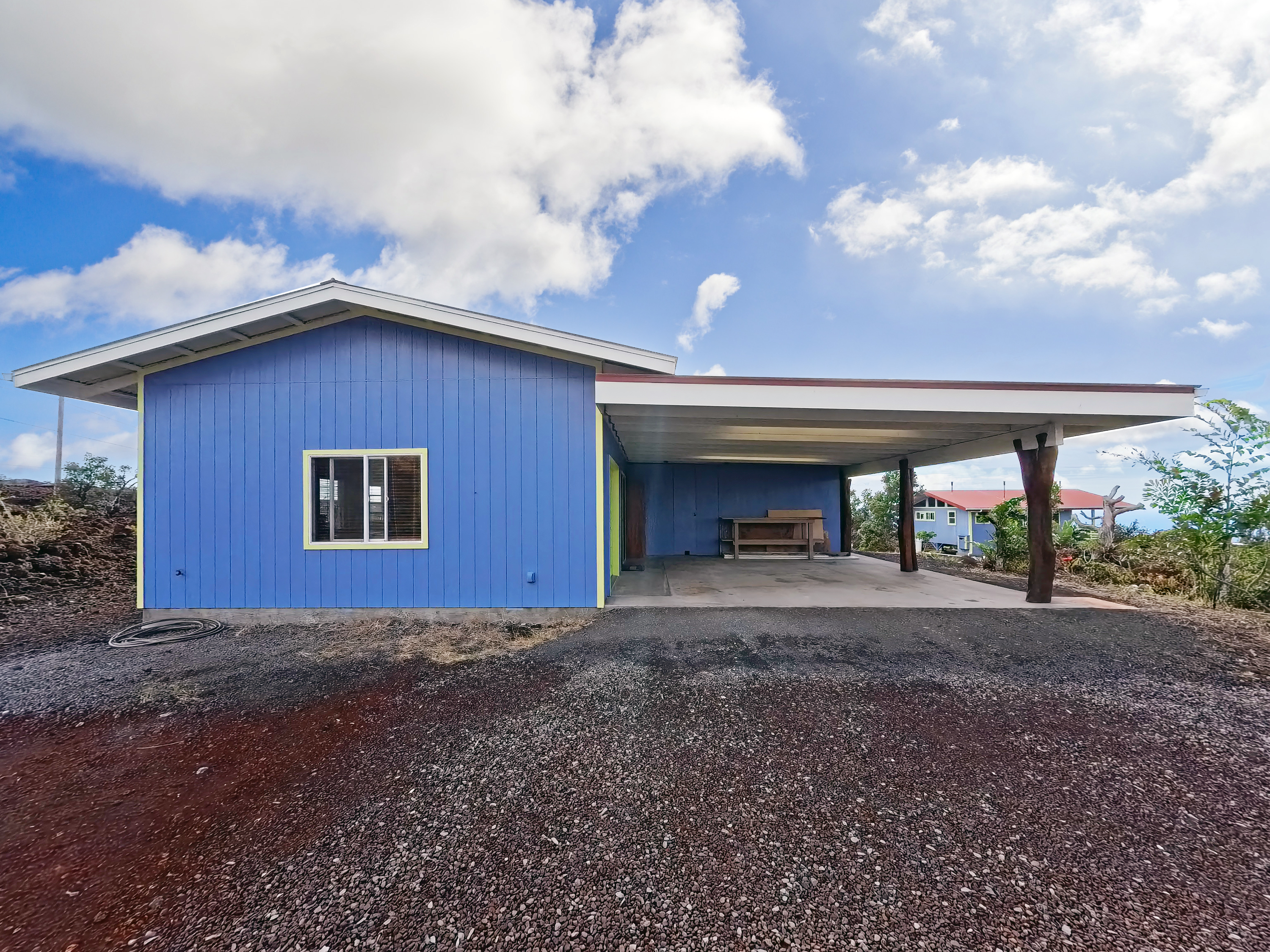92-8427 Hibiscus Drive Ocean View, HI 96704 - Photo 24 of 30 a house with yard in front of it