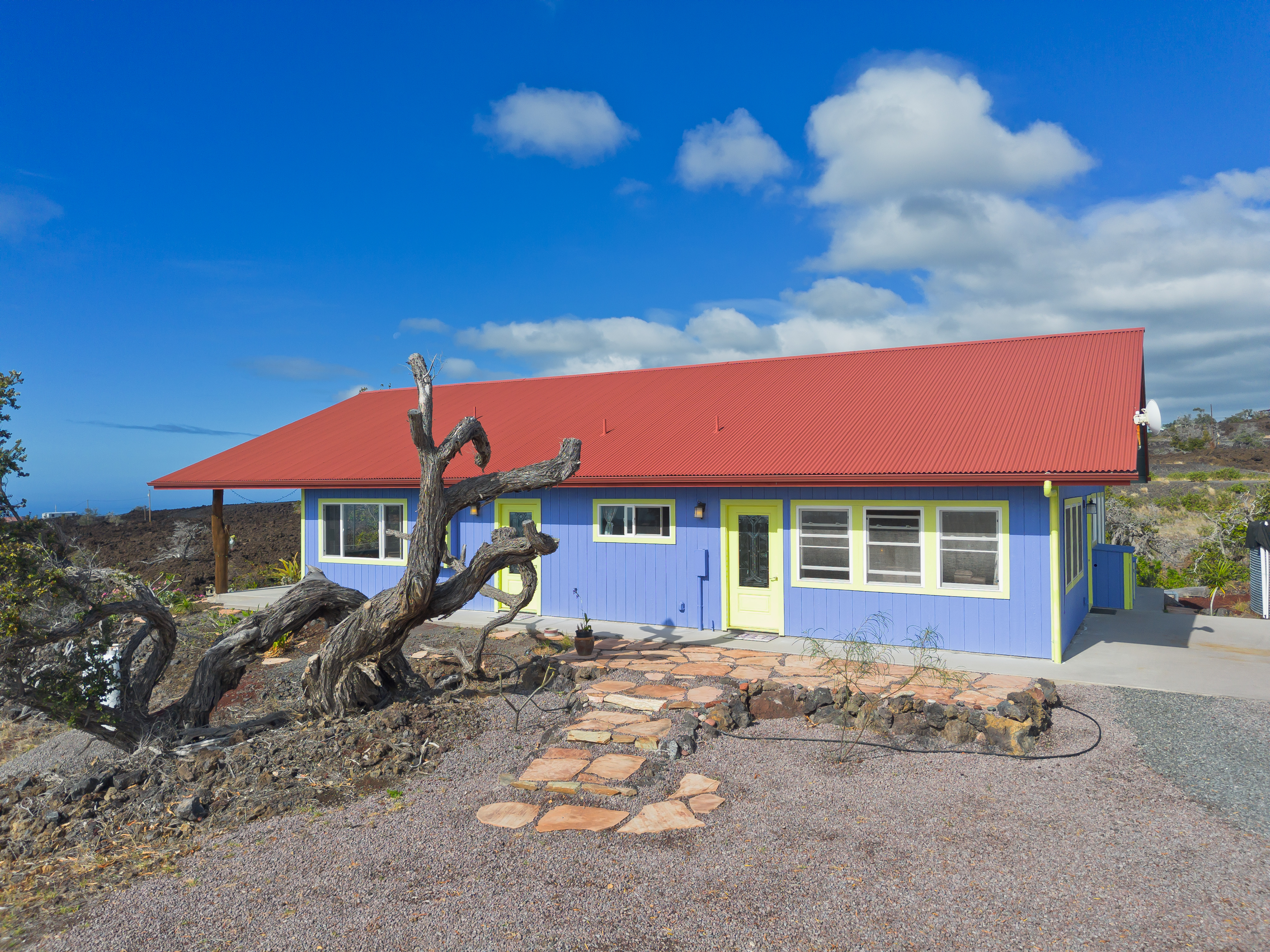 92-8427 Hibiscus Drive Ocean View, HI 96704 - Photo 3 of 30 a view of a house with a yard