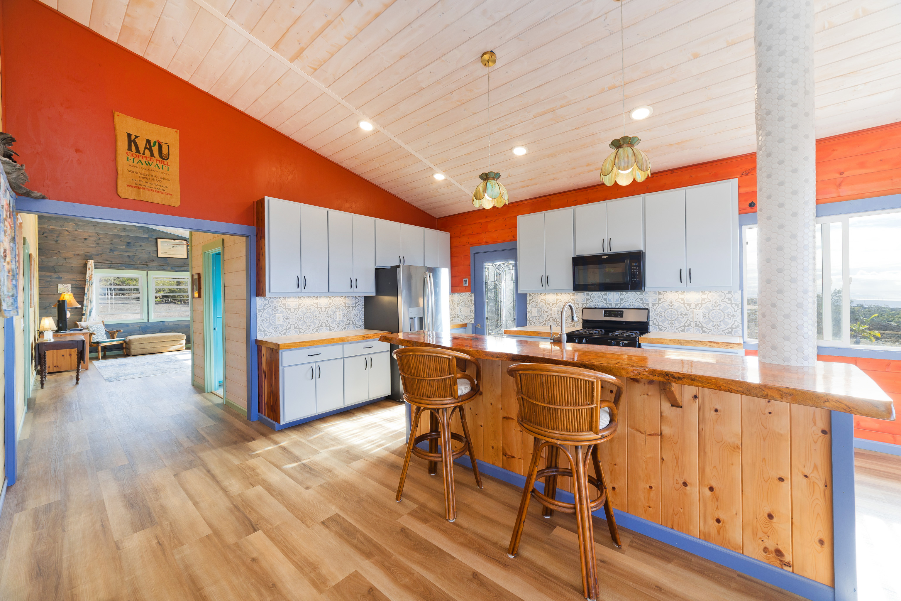 92-8427 Hibiscus Drive Ocean View, HI 96704 - Photo 10 of 30 a large kitchen with a table and chairs in it