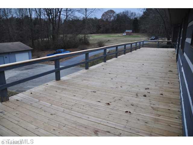6711 Bastille Lane Oak Ridge, NC 27310 - Photo 15 of 16 Other. New Rear Deck for you to relax on in the evening shadows. or just enjoy the nature of this 2.51 acres.