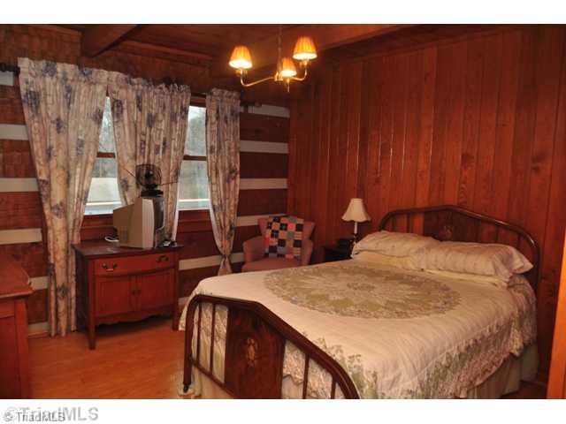 6711 Bastille Lane Oak Ridge, NC 27310 - Photo 8 of 16 2nd Bedroom. Snooze away in this cozy 2nd bedroom.