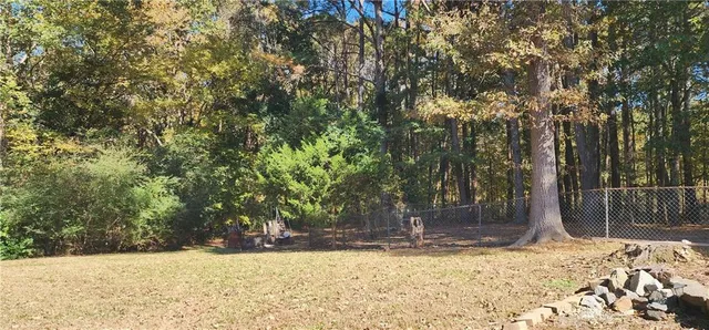 a view of a yard with a tree