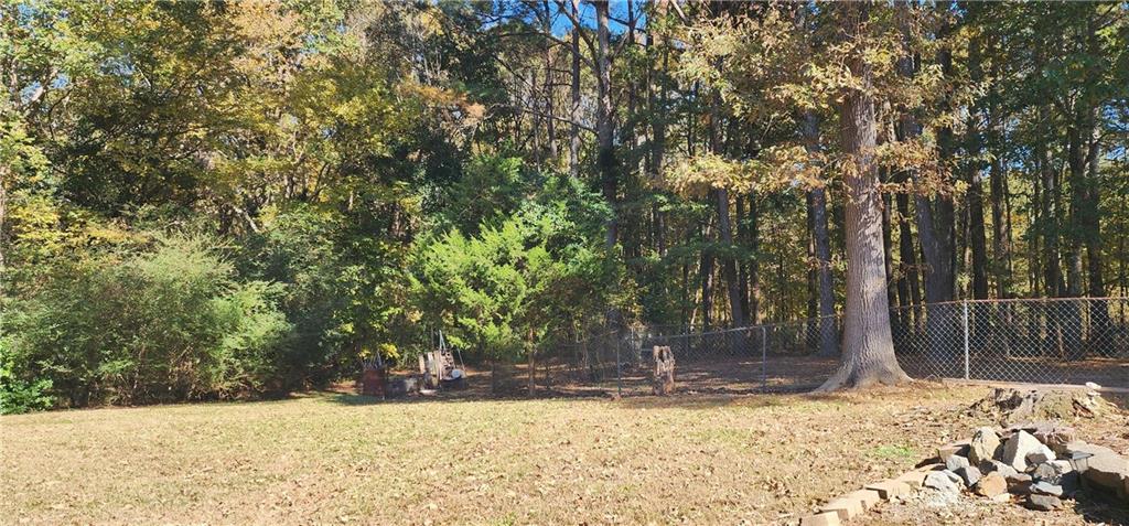 211 Brooks Lane Winder, GA 30680 - Photo 16 of 27 a view of a yard with a tree