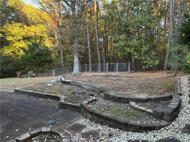 a backyard of a house with lots of green space