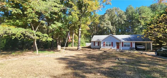 a house with trees in the background