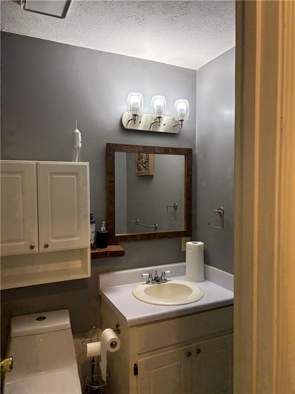 211 Brooks Lane Winder, GA 30680 - Photo 23 of 27 a bathroom with a sink and a mirror