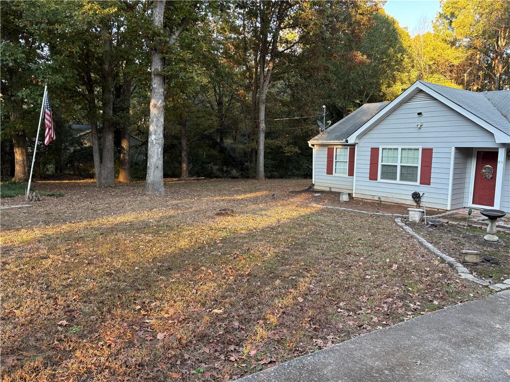 211 Brooks Lane Winder, GA 30680 - Photo 3 of 27 a view of a house with a yard