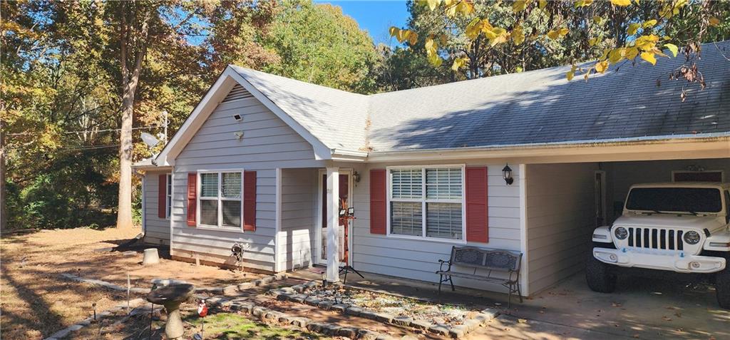 211 Brooks Lane Winder, GA 30680 - Photo 4 of 27 a backyard of a house with deck and outdoor seating