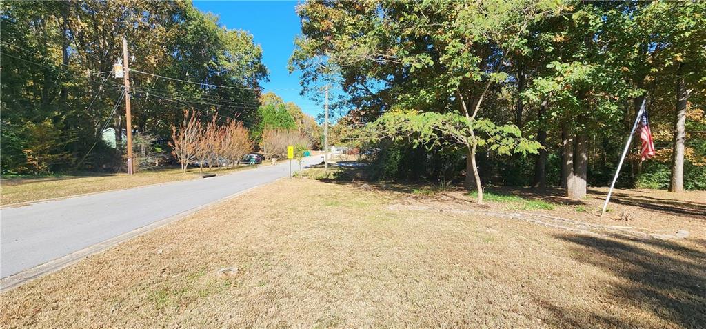 211 Brooks Lane Winder, GA 30680 - Photo 7 of 27 a backyard of a house with palm trees