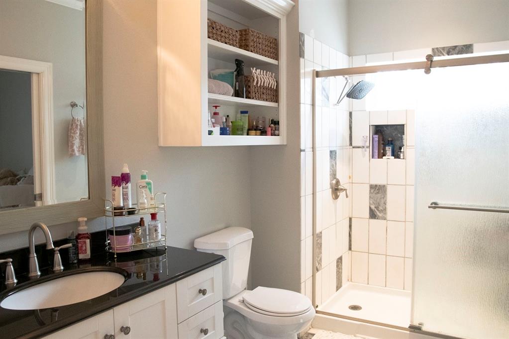 298 Redbud A Mexia, TX 76667 - Photo 22 of 40 a bathroom with a granite countertop sink mirror vanity and toilet