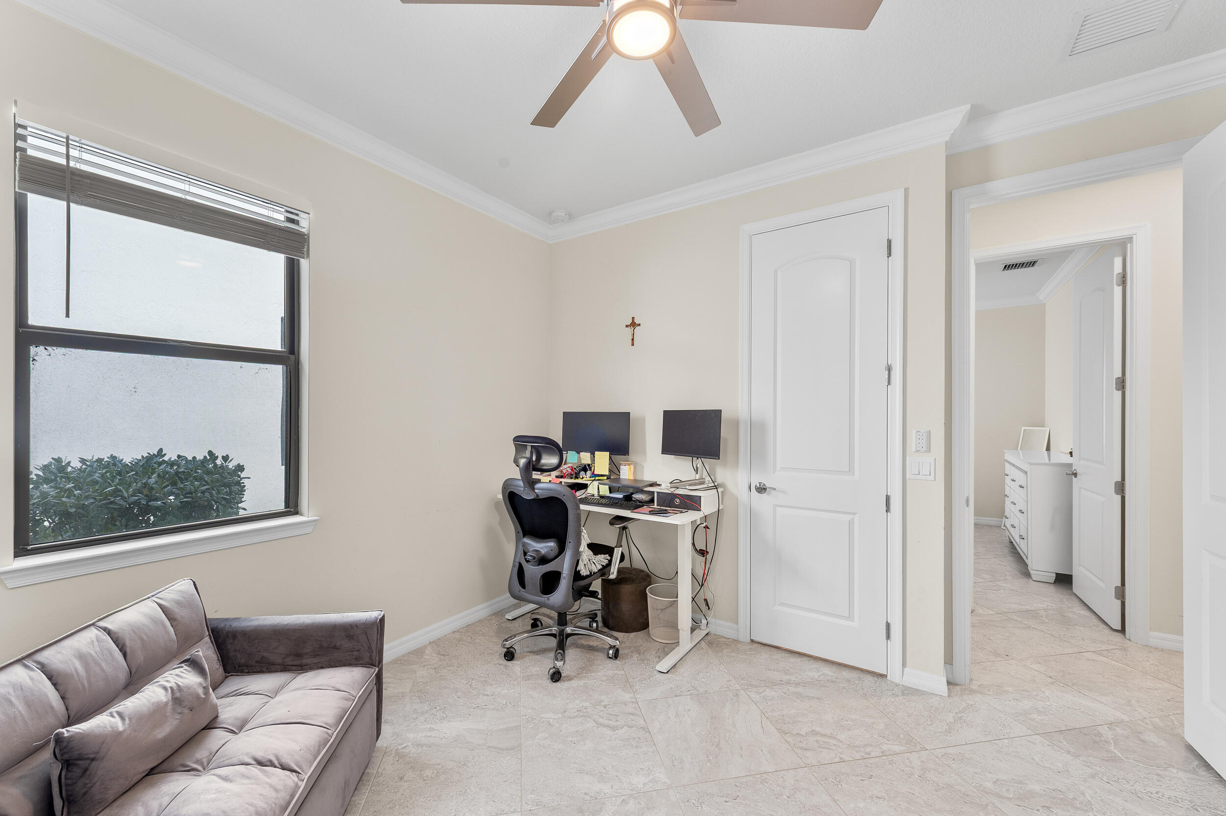 4762 Roldan Court Lake Worth, FL 33467 - Photo 13 of 33 a view of a livingroom with workspace and a window