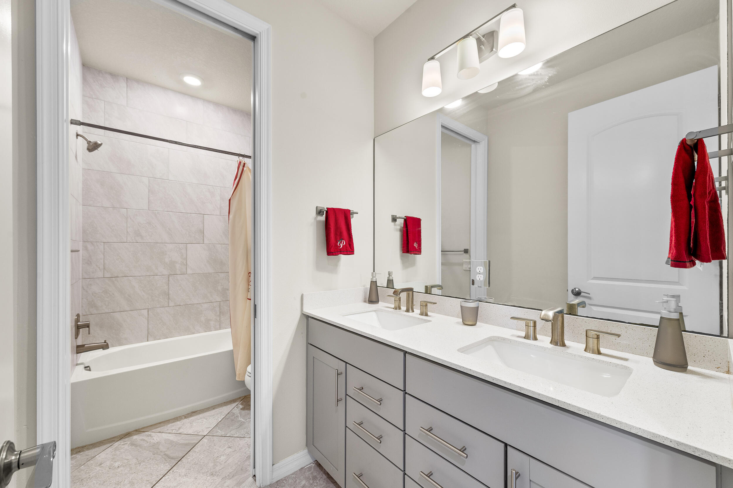 4762 Roldan Court Lake Worth, FL 33467 - Photo 18 of 33 a bathroom with a tub sink and mirror