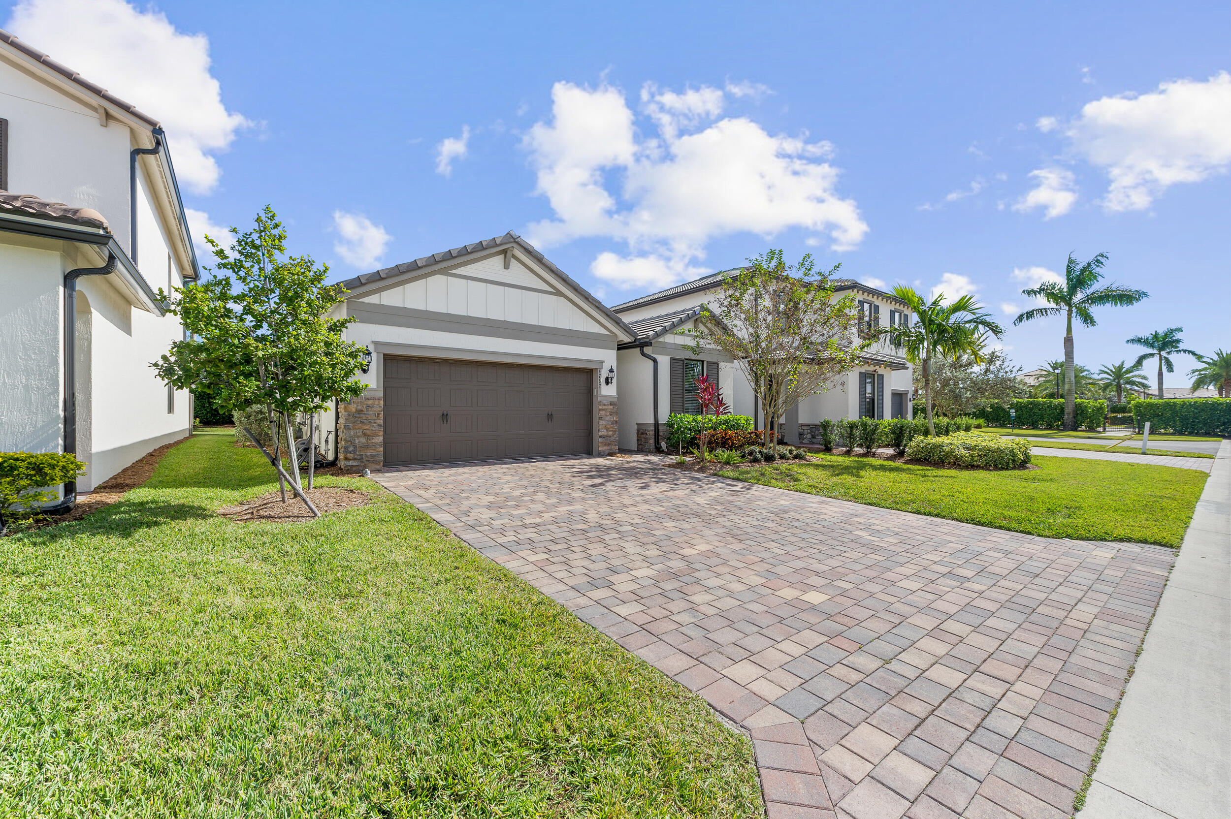 4762 Roldan Court Lake Worth, FL 33467 - Photo 2 of 33 a view of a house with a big yard and potted plants