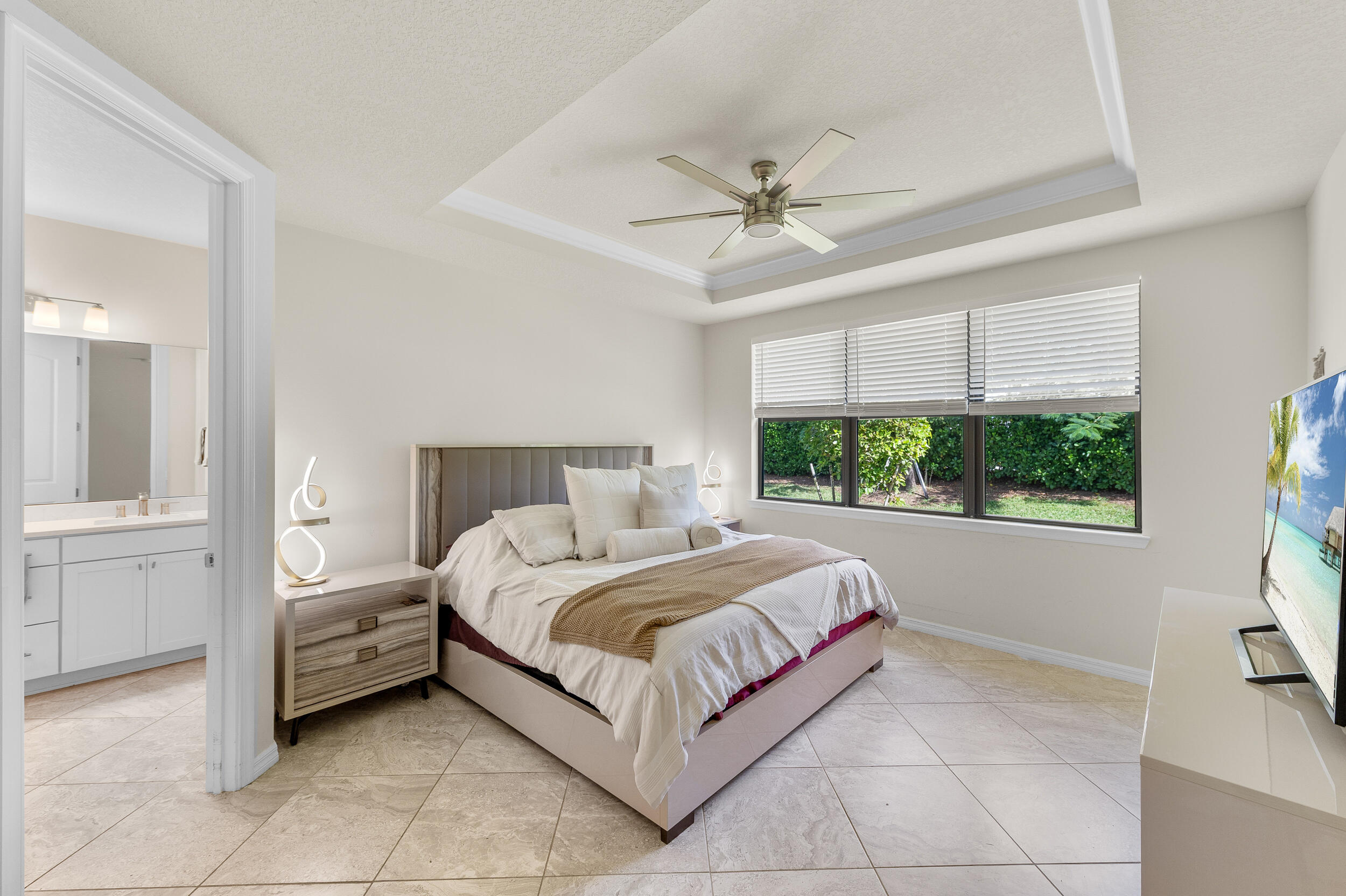 4762 Roldan Court Lake Worth, FL 33467 - Photo 21 of 33 a bedroom with a large bed and a window