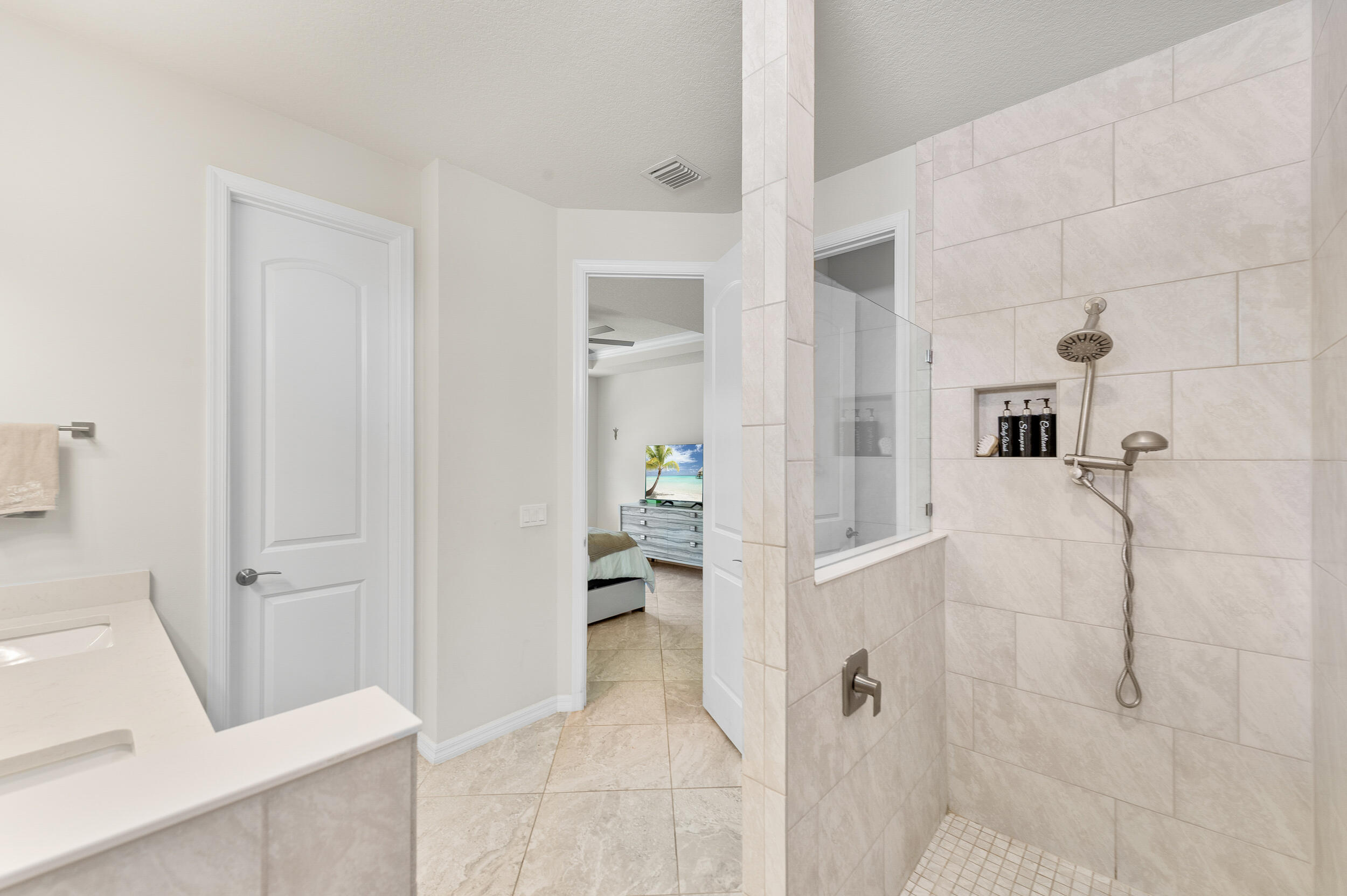 4762 Roldan Court Lake Worth, FL 33467 - Photo 26 of 33 a bathroom with a tub and a shower
