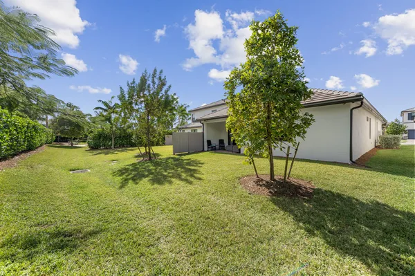 a backyard of a house with lots of green space