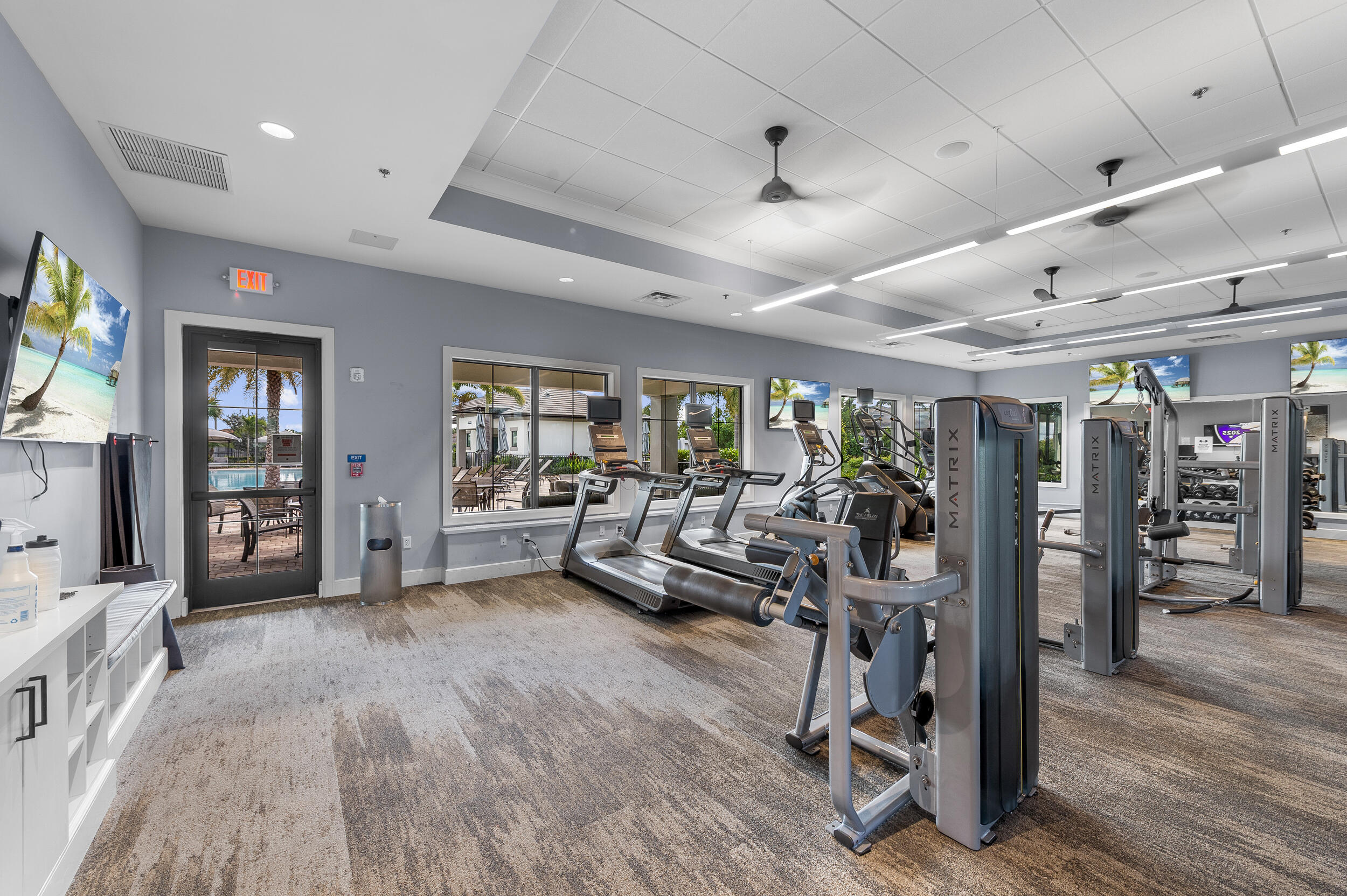 4762 Roldan Court Lake Worth, FL 33467 - Photo 31 of 33 a view of a room with lots of wooden furniture and windows