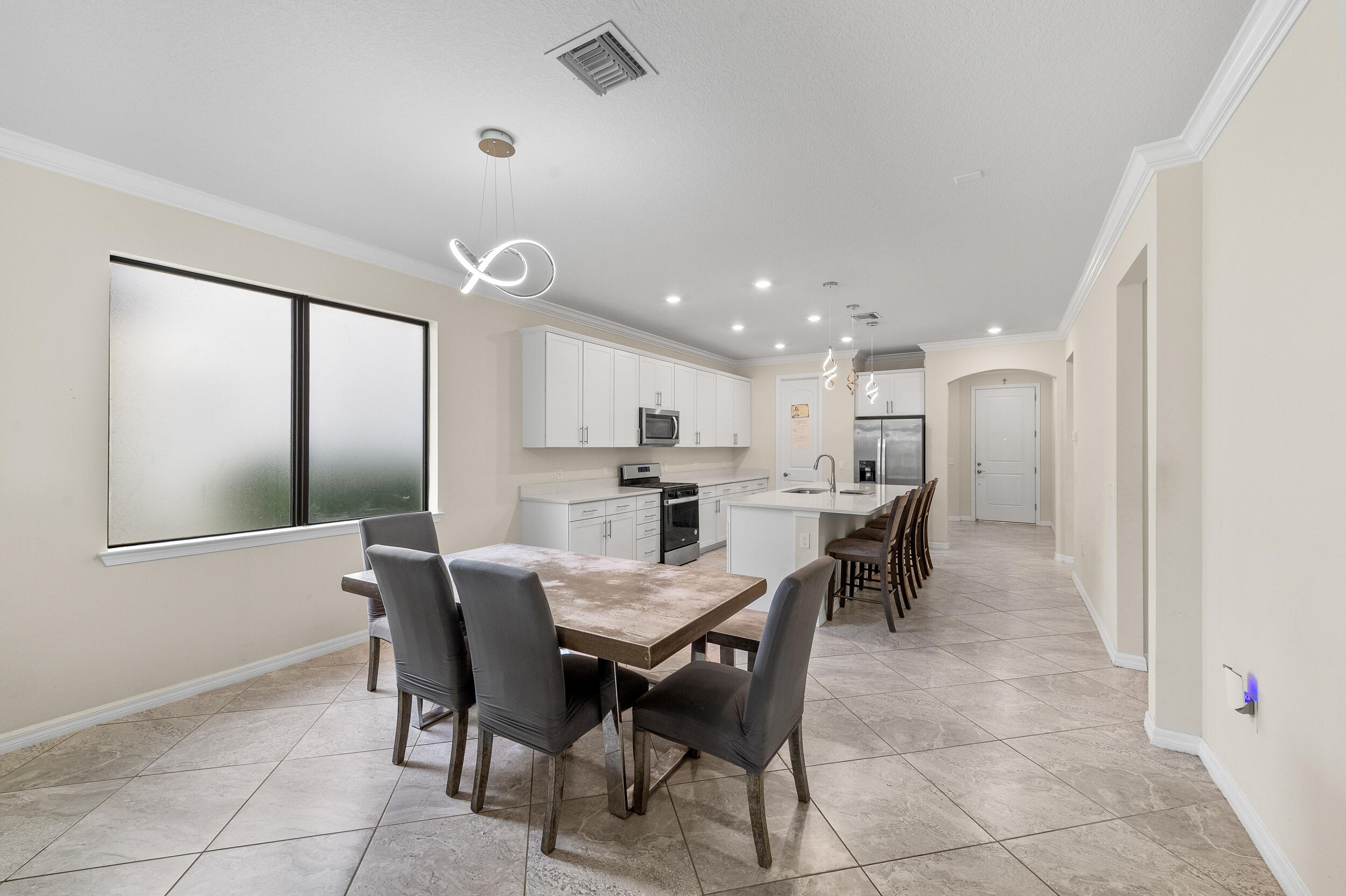 4762 Roldan Court Lake Worth, FL 33467 - Photo 9 of 33 a view of a dining room with furniture