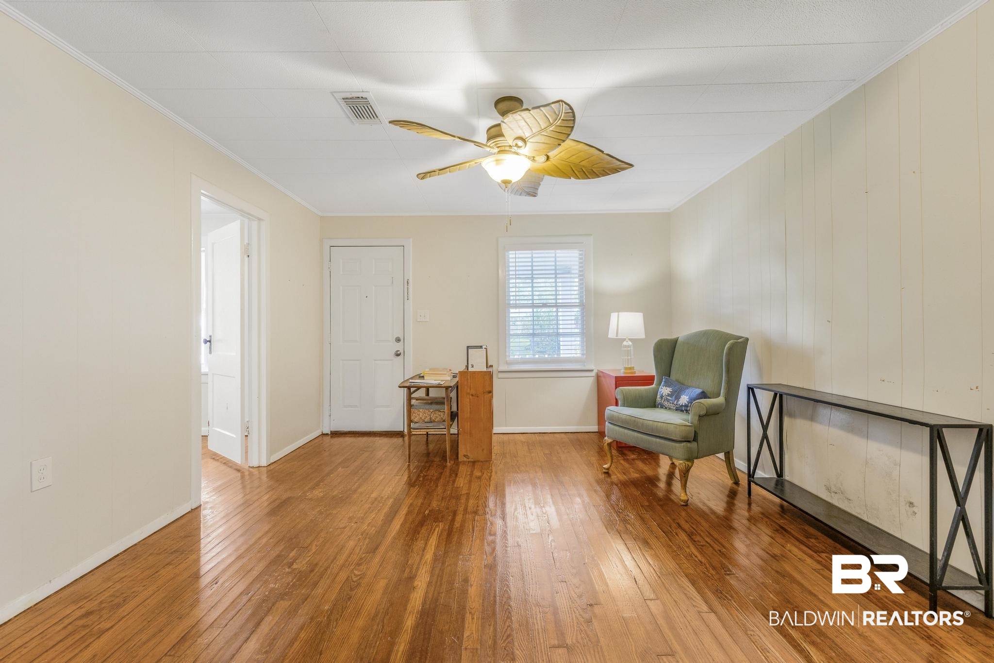405 North Pine Street Foley, AL 36535 - Photo 16 of 33 Living room with hardwood / wood-style flooring, ornamental molding, and a ceiling fan